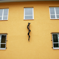 A snake on a rod as a symbol of medicine forged in the Blacksmith's Art Studio UKOVMI for a medical center A snake on a rod as a symbol of medicine forged in the Blacksmith's Art Studio UKOVMI for a medical center