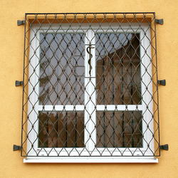Wrought-iron grilles Waves on the window with a snake in the middle – Levoča pharmacy Wrought-iron grilles Waves on the window with a snake in the middle – Levoča pharmacy