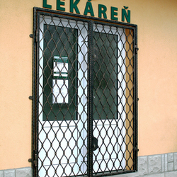 Wrought-iron grilles Wave on the door of a pharmacy in Levoča Wrought-iron grilles Wave on the door of a pharmacy in Levoča