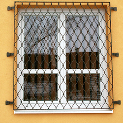 Wrought-iron grilles in the shape of waves on windows made in UKOVMI Wrought-iron grilles in the shape of waves on windows made in UKOVMI